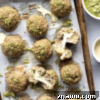 Stuffed with gooey mozzarella cheese and baked with lots of fresh basil pesto, these pesto turkey meatballs are incredible over a bowl of pasta!