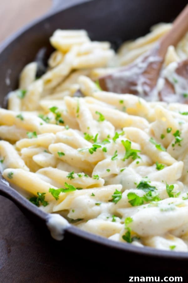 Quick Creamy Cauliflower Pasta Alfredo 12 A close-up shot of the finished cauliflower Alfredo pasta, ready to be savored. @WholeHeavenly
