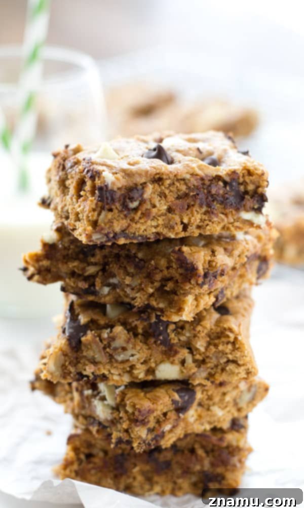 Irresistibly Soft Chewy Blondies 6 A close-up shot of a single ultimate chewy blondie, highlighting its rich, moist crumb and the perfect distribution of chocolate and nuts.