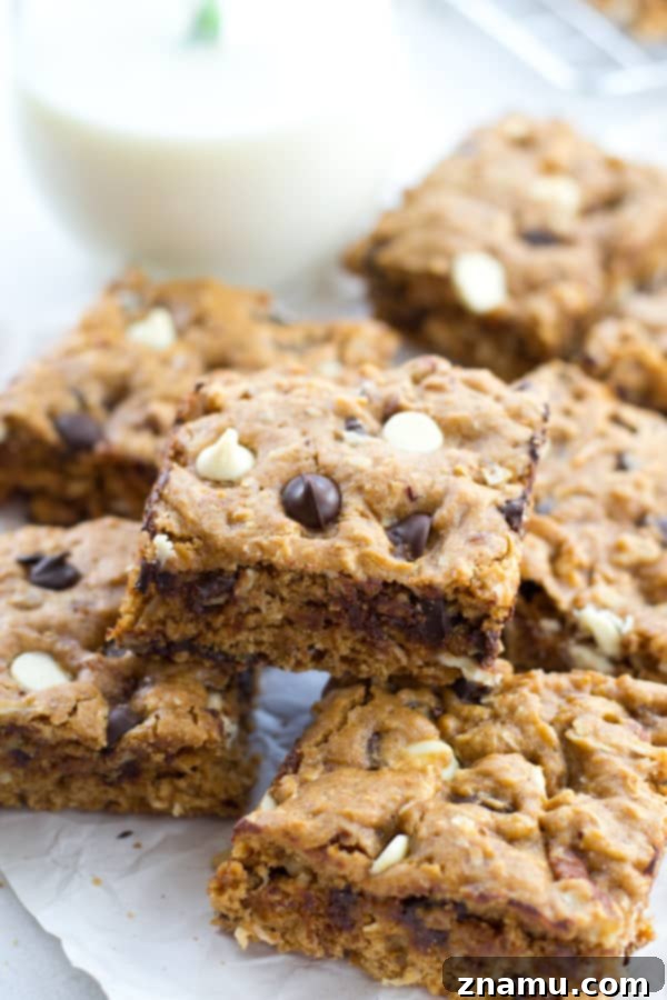 Irresistibly Soft Chewy Blondies 8 A beautifully arranged serving of chewy blondies with a glass of milk, ready for a sweet treat.