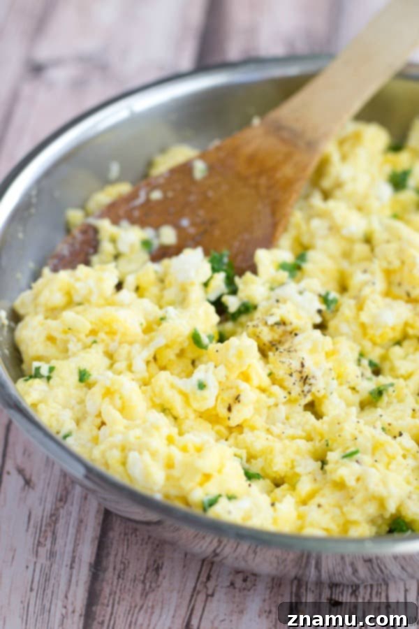 The Scramble Melt 4 Freshly made Scrambled Egg Grilled Cheese on a cutting board, ready to be served