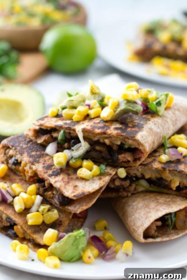 Cheesy Beef and Bean Quesadillas with fresh Corn-Avocado Salsa, perfect for a fun Mexican night
