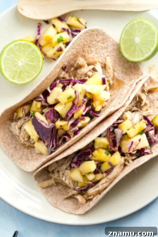 Slow-Cooked Jerk Chicken Tacos with Tropical Pineapple Slaw 3 Tender Slow-Cooked Jerk Chicken for Tacos