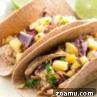 Slow-Cooked Jerk Chicken Tacos with Tropical Pineapple Slaw 9 Slow-Cooked Jerk Chicken Tacos