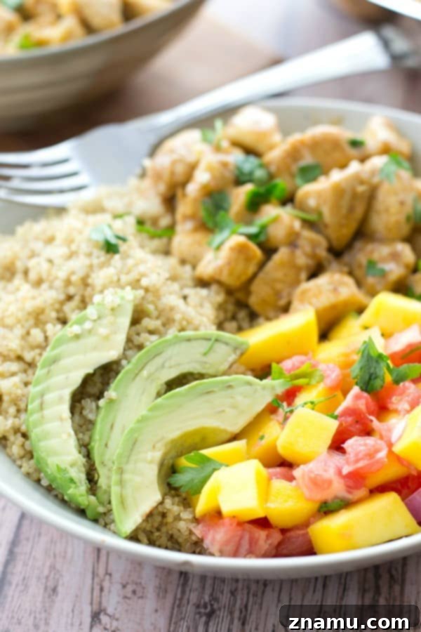 Zesty Honey Mustard Chicken Quinoa Bowls with Tropical Salsa 5 A bright and colorful close-up of the freshly prepared mango-citrus salsa, highlighting its vibrant ingredients
