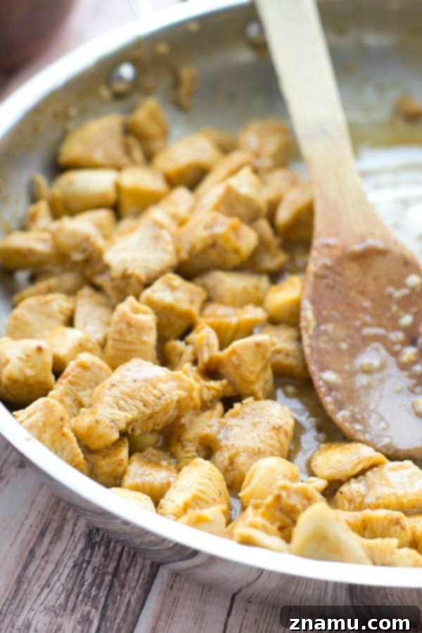Zesty Honey Mustard Chicken Quinoa Bowls with Tropical Salsa 6 A beautifully arranged honey mustard chicken quinoa bowl, seen from a slightly elevated angle, highlighting all the ingredients
