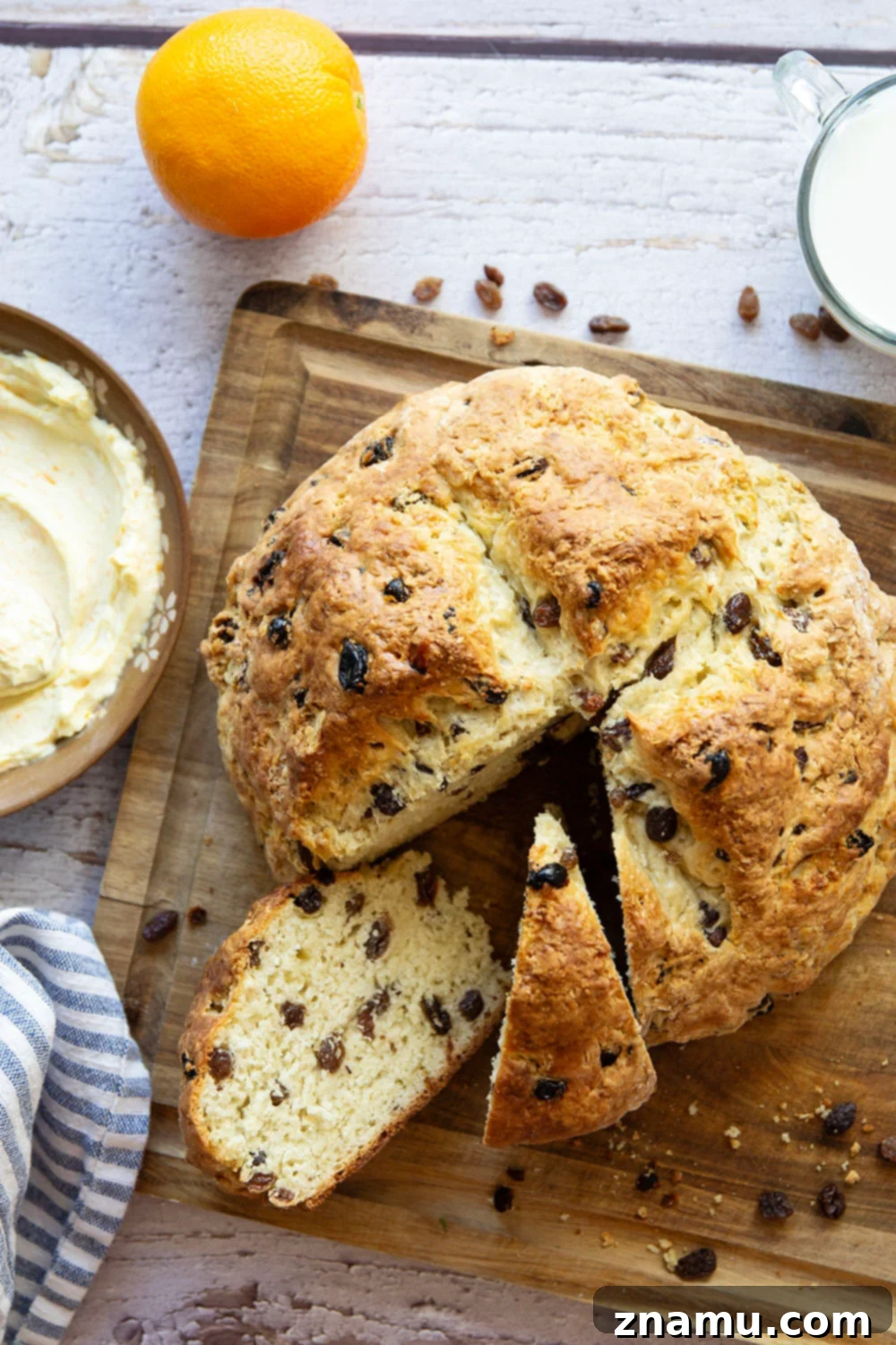 Sunshine Orange Irish Soda Bread with Cream Cheese 2 Hearty Irish soda bread with a soft, tender inside and sweet raisins, served warm with tangy orange cream cheese.