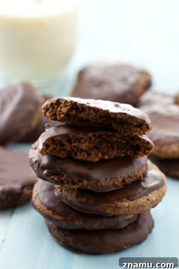 Grain-Free Mint Chocolate Wafers 5 Several Thin Mints arranged on a cooling rack, allowing the chocolate coating to fully set and harden.