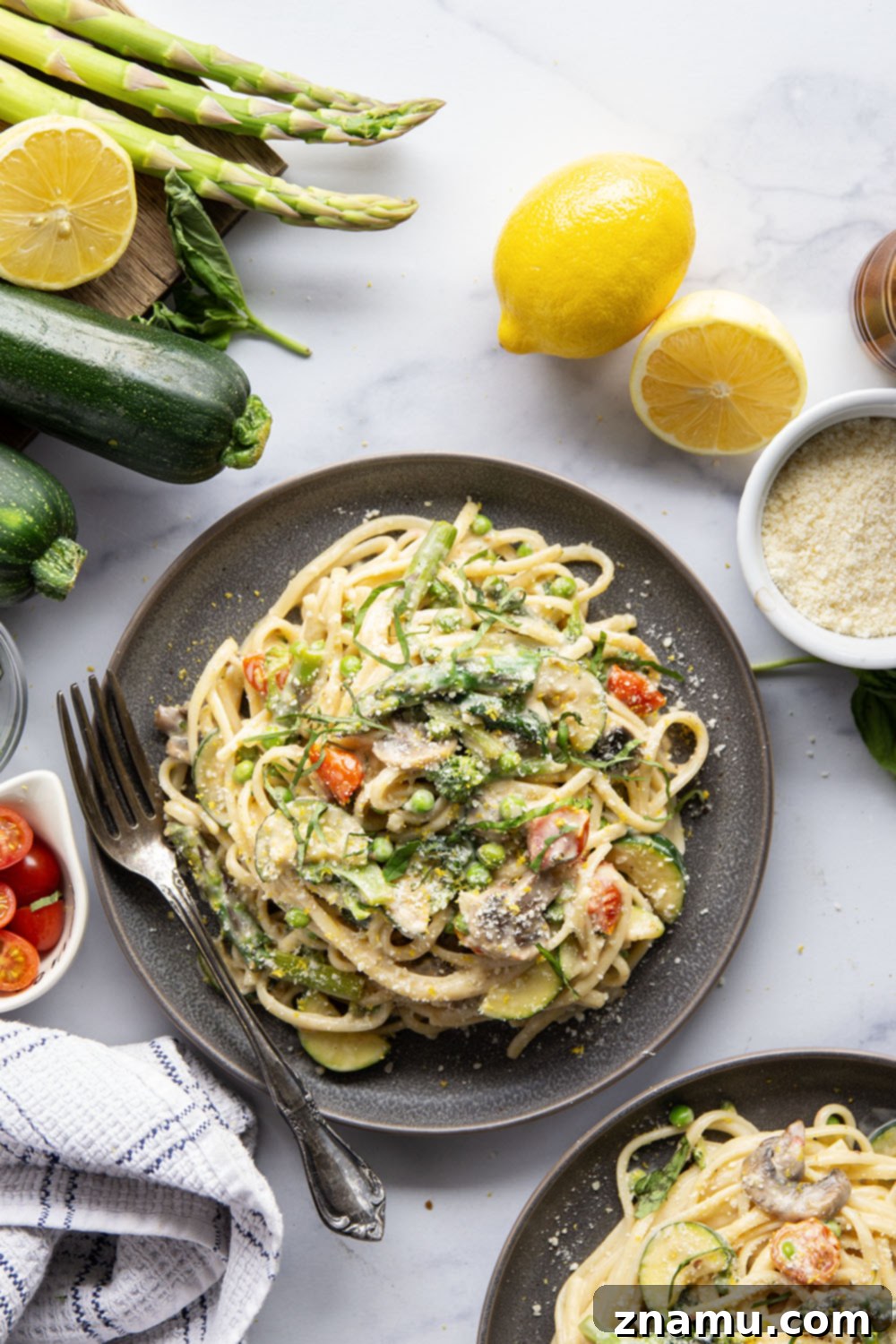Vibrant Garden Pasta for Spring 6 A close-up of a fork lifting a perfect bite of Spring Pasta Primavera, showcasing the creamy sauce, pasta, and perfectly cooked vegetables.