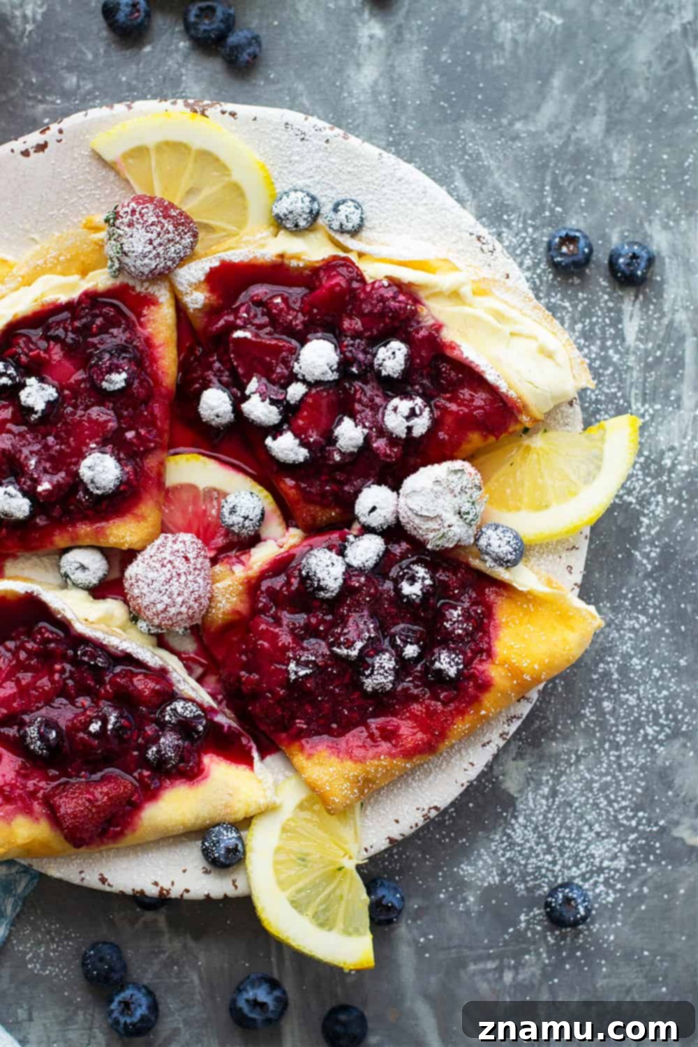Berries & Cream Cheese Crepes 2 Perfectly lacy mixed berry cream cheese crepes, ready for a delicious homemade brunch
