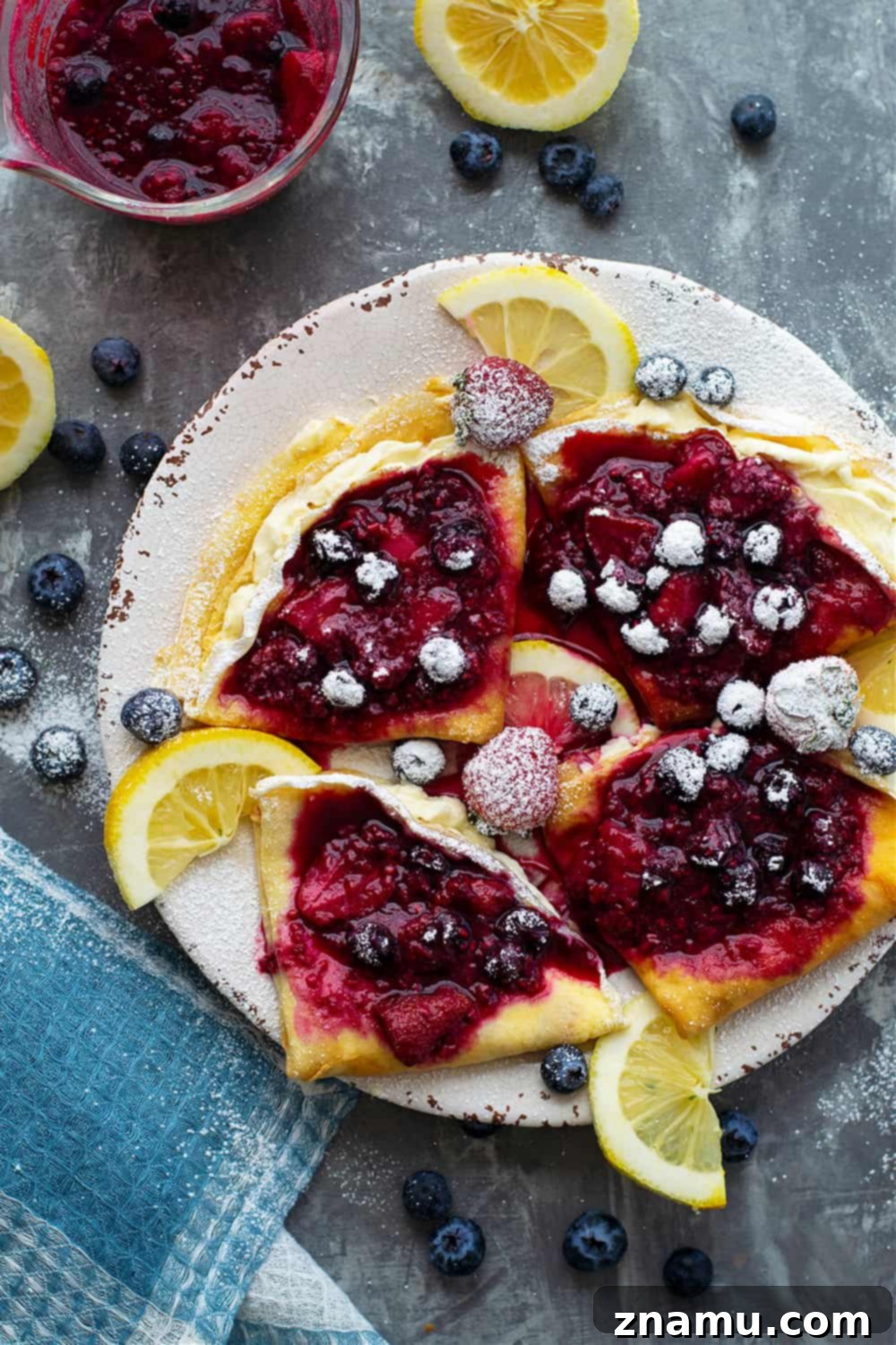 Berries & Cream Cheese Crepes 4 Mixed berry cream cheese crepes drizzled with berry sauce and powdered sugar