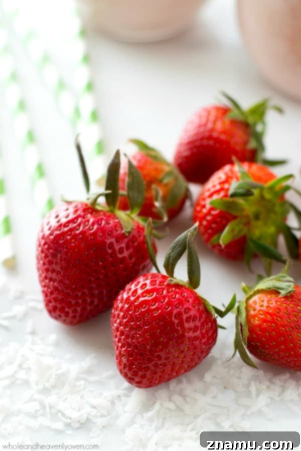 Refreshing Strawberry Piña Colada Protein Smoothie with fresh ingredients.