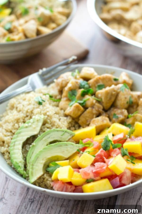 These easy quinoa bowls are loaded with SO much flavor and you won't believe how quickly they come together! The honey mustard chicken pairs perfectly with fluffy quinoa and a sweet tropical salsa. @WholeHeavenly