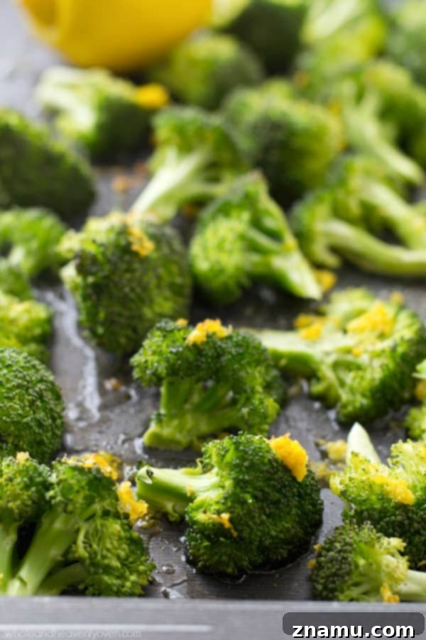 Crispy Lemon Roasted Broccoli and a Cookbook Giveaway 3 Close-up of lemon-roasted broccoli in a bowl, showcasing the crispy edges and vibrant color.