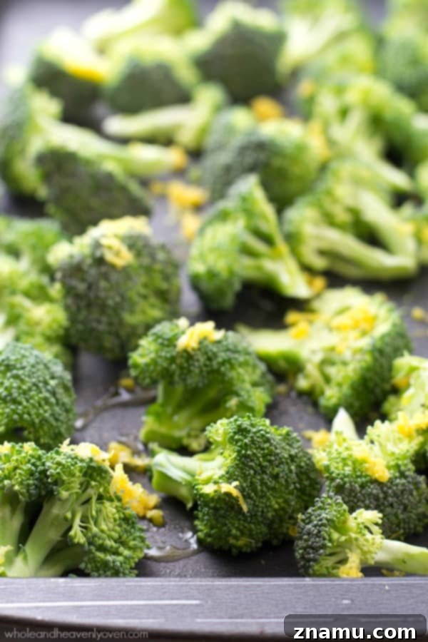 Crispy Lemon Roasted Broccoli and a Cookbook Giveaway 6 A close-up of a single broccoli floret, roasted to perfection with visible lemon zest and crispy bits.