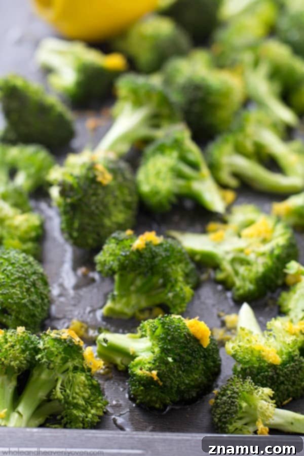 Crispy Lemon Roasted Broccoli and a Cookbook Giveaway 9 A large bowl of lemon-roasted broccoli with a wooden serving spoon, ready for a family meal.