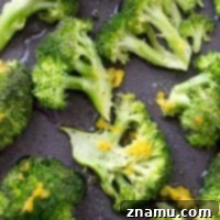 Crispy Lemon Roasted Broccoli and a Cookbook Giveaway 10 Close-up of freshly roasted broccoli with lemon slices.