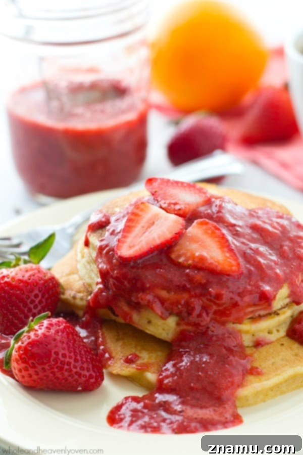 Zesty Orange Greek Yogurt Pancakes crowned with Roasted Strawberry Compote 4 Ingredients for orange Greek yogurt pancakes, including fresh oranges, greek yogurt, and buttermilk, laid out on a kitchen counter.