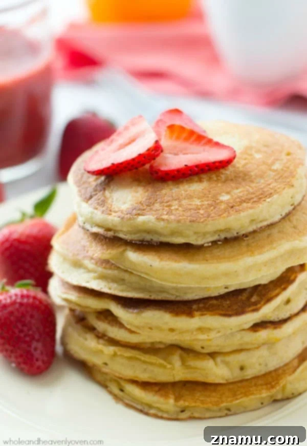 Zesty Orange Greek Yogurt Pancakes crowned with Roasted Strawberry Compote 6 Fresh strawberries sliced and arranged on a baking sheet, drizzled with maple syrup and sprinkled with cinnamon, before roasting for the sauce.