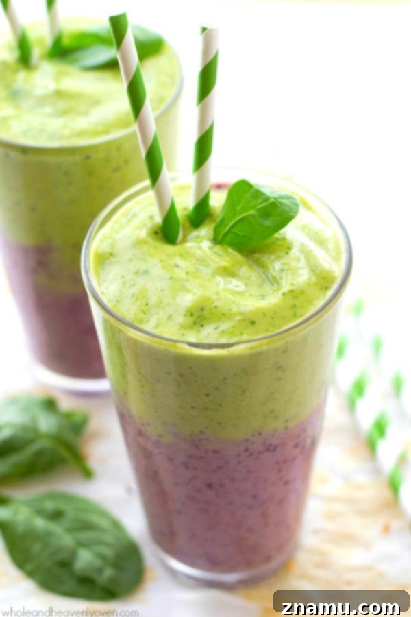 Vibrant Berry Green Energy Swirl 4 Close-up of the top layers of a mixed berry and green smoothie in a glass