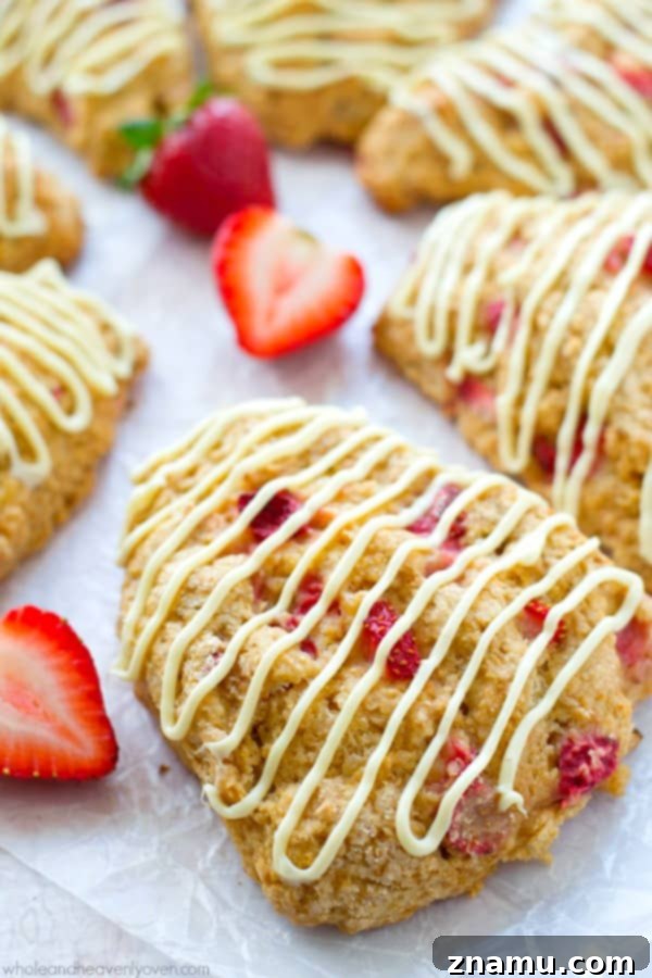 White Chocolate Strawberry Cream Scones 4 A plate of freshly baked strawberry scones, ready to be drizzled with white chocolate, promising a delightful treat