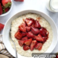 Maple roasted strawberries and creamy steel-cut oats are a match made in heaven with these easy strawberry steel-cut oats!