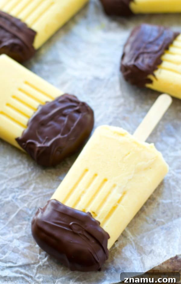 Vanilla Chocolate Pudding Pops 2 These creamy vanilla pudding popsicles are the perfect way to beat the heat this summer! Dipping them in melted chocolate makes them even more fun! @WholeHeavenly