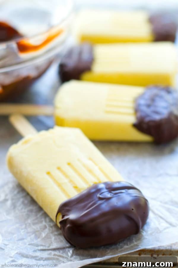 Vanilla Chocolate Pudding Pops 12 These creamy vanilla pudding popsicles are the perfect way to beat the heat this summer! Dipping them in melted chocolate makes them even more fun! @WholeHeavenly
