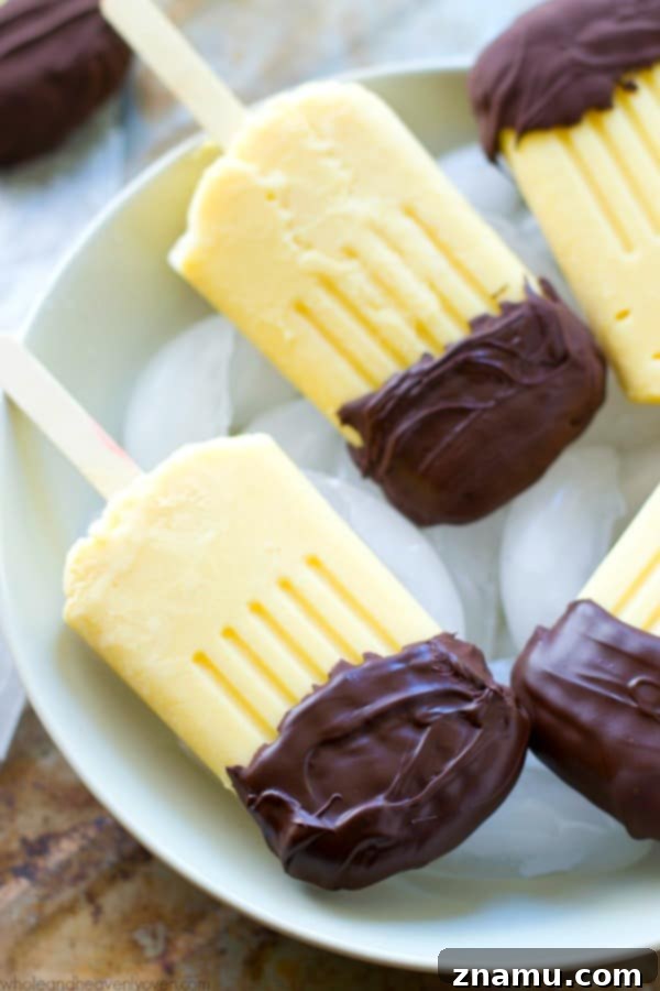 Vanilla Chocolate Pudding Pops 3 These creamy vanilla pudding popsicles are the perfect way to beat the heat this summer! Dipping them in melted chocolate makes them even more fun! @WholeHeavenly