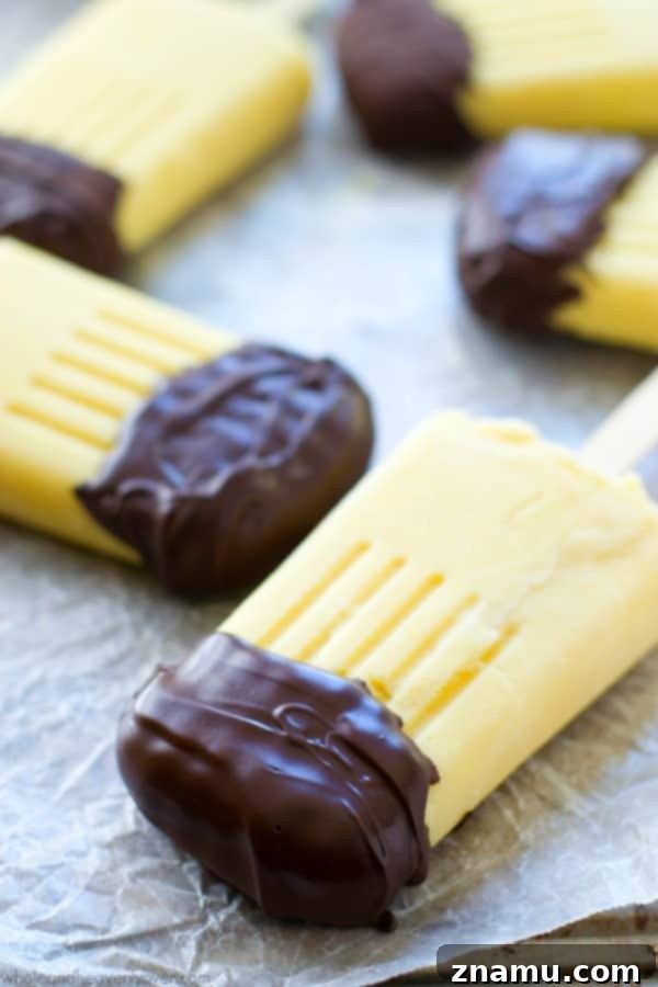Vanilla Chocolate Pudding Pops 4 These creamy vanilla pudding popsicles are the perfect way to beat the heat this summer! Dipping them in melted chocolate makes them even more fun! @WholeHeavenly