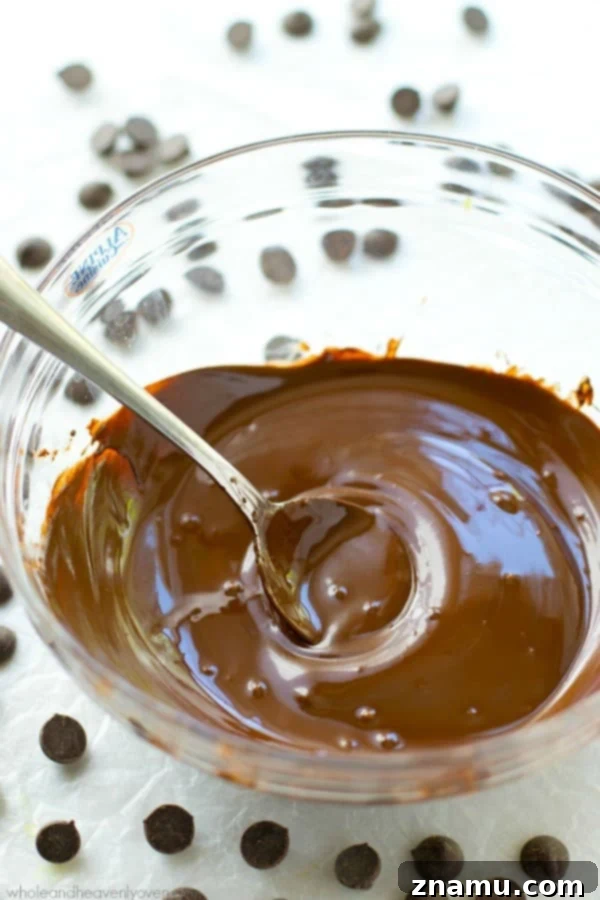 Mastering the Art of Chocolate Melting 6 A bowl of perfectly smooth, melted chocolate ready to be used in various dessert applications.