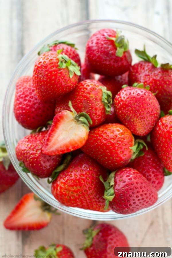 Decadent Double Chocolate Strawberry Banana Loaf 5 A bowl of fresh, ripe strawberries, highlighting their natural beauty.