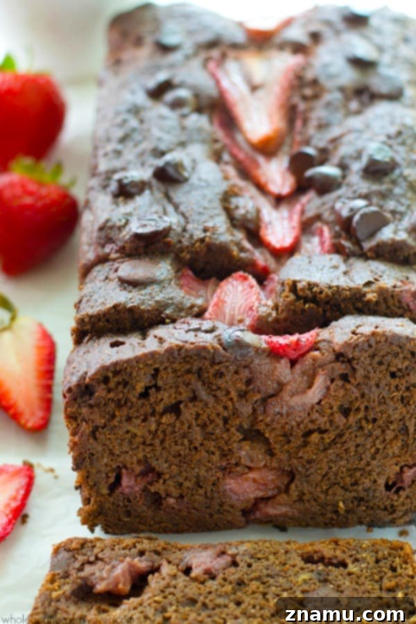 Decadent Double Chocolate Strawberry Banana Loaf 6 A close-up of a freshly baked loaf of Double Chocolate Strawberry Banana Bread, rich with chocolate and strawberries.