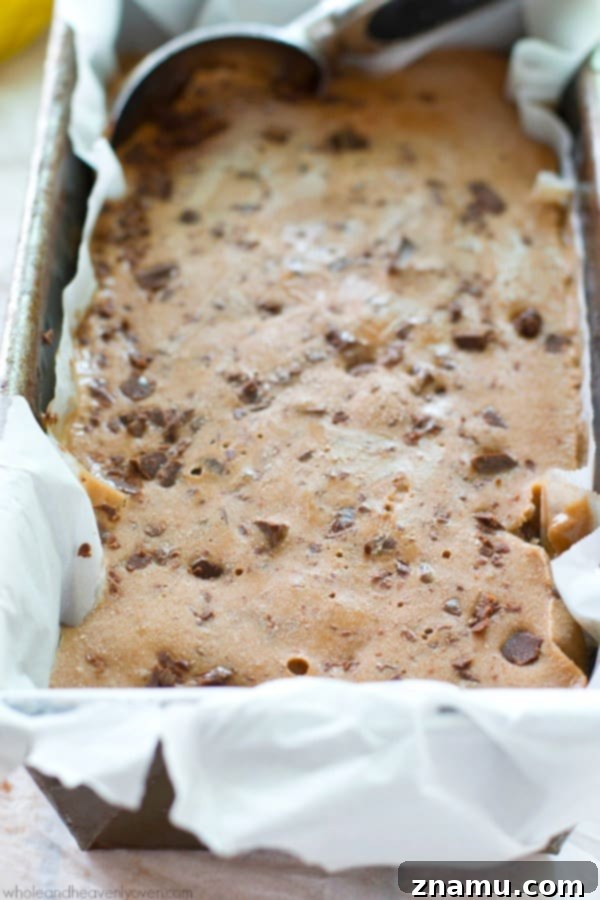 Light Mocha Banana Crunch Bliss 4 Scoops of mocha banana crunch ice cream topped with chocolate shavings in a bowl.