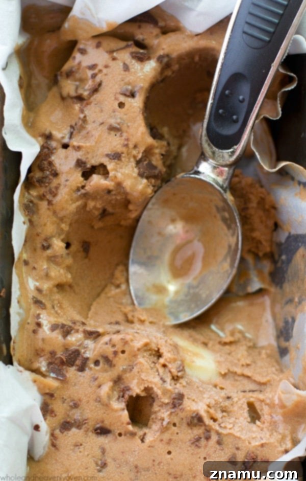 Light Mocha Banana Crunch Bliss 6 Overhead view of mocha banana ice cream with chocolate pieces, ready to be enjoyed.