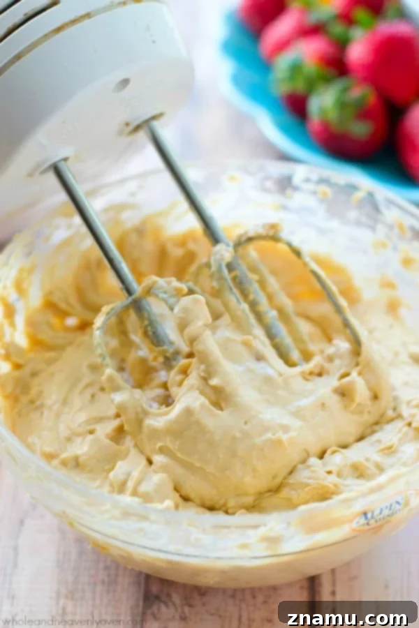No-Bake 5-Minute Peanut Butter Cheesecake Dip 5 Mixing ingredients for Peanut Butter Cheesecake Dip