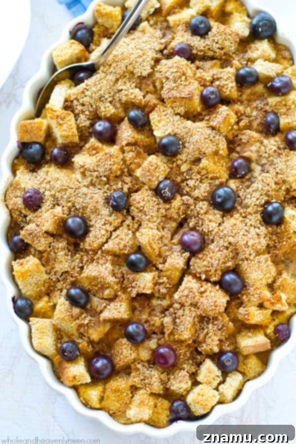 Baked Blueberry Streusel French Toast Bliss 6 A full pan of blueberry streusel french toast bake, still warm, with golden-brown topping and visible blueberries.