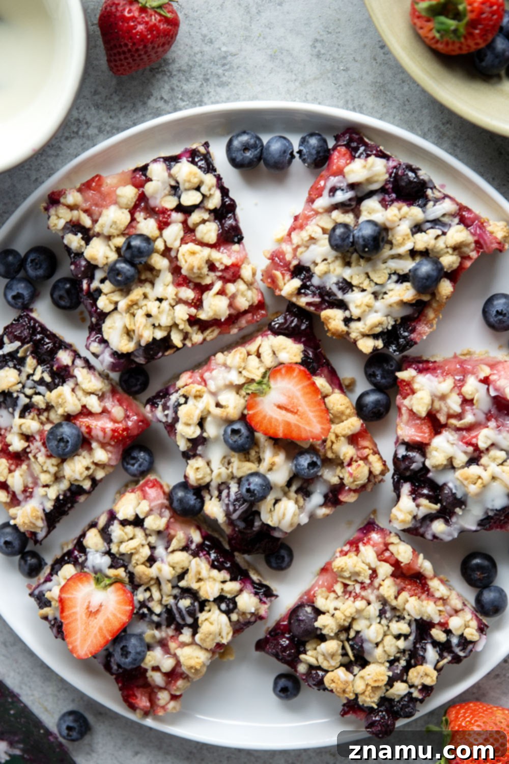 Liberty Layers 5 Loaded with a double whammy of berries, lots of streusel, and a creamy vanilla glaze, these red white and blue bars are an easy, festive treat for the 4th of July!