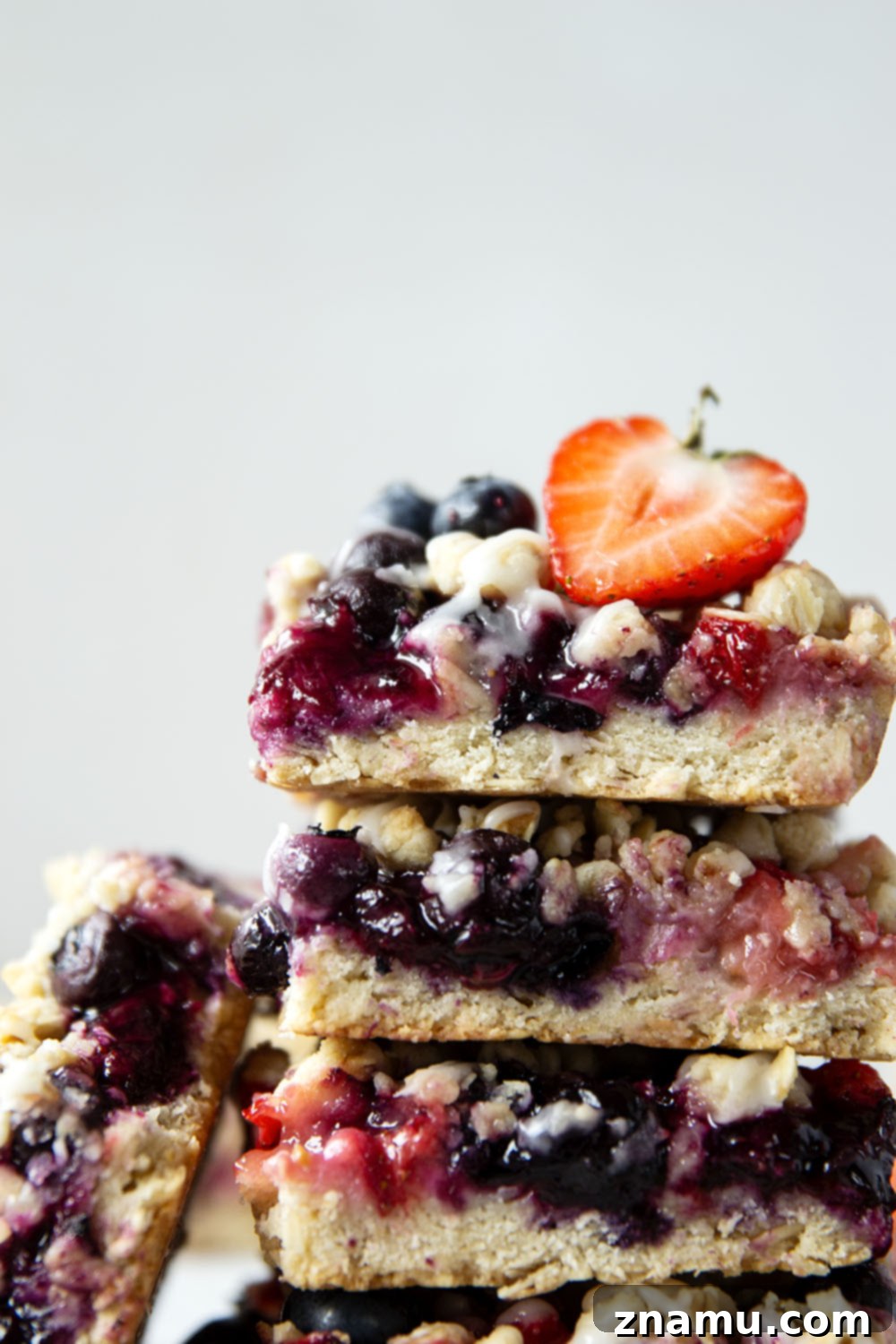 Liberty Layers 6 Loaded with a double whammy of berries, lots of streusel, and a creamy vanilla glaze, these red white and blue bars are an easy, festive treat for the 4th of July!