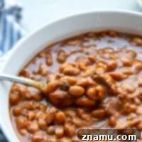 These slow cooker baked beans are made completely from scratch in the slow cooker and perfectly sweet and hearty. Bring these baked beans to any cookout and watch them be the star of the side dishes!