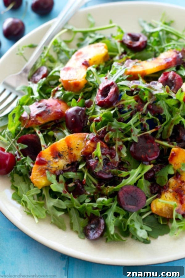 Golden Peach & Arugula with Ruby Balsam Elegance 3 Close-up view of the grilled peach and cherry arugula salad, highlighting the juicy texture of the fruit and crispness of the arugula. @WholeHeavenly