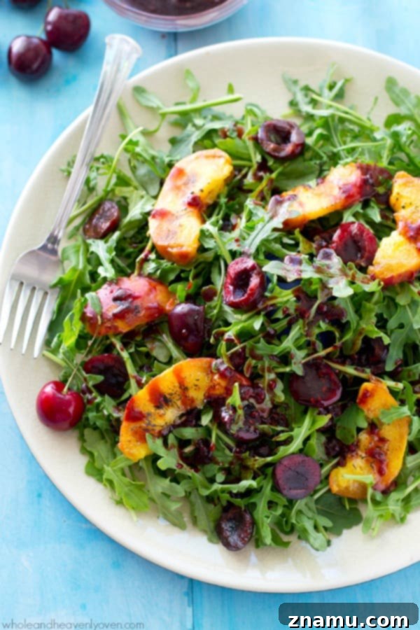 Golden Peach & Arugula with Ruby Balsam Elegance 5 Gourmet presentation of the grilled peach and cherry arugula salad, showcasing its vibrant colors and inviting textures. @WholeHeavenly