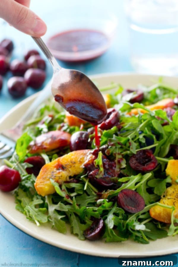 Golden Peach & Arugula with Ruby Balsam Elegance 6 The fully dressed grilled peach and arugula salad with cherries, highlighting the glistening raspberry balsamic vinaigrette and ready-to-serve presentation. @WholeHeavenly