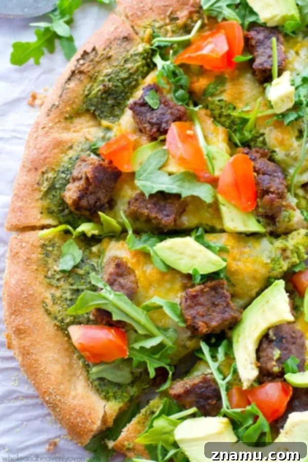 California Pesto Cheeseburger Pizza 3 Close-up of a loaded California-style pizza with fresh toppings and grilled veggie burger crumbles.