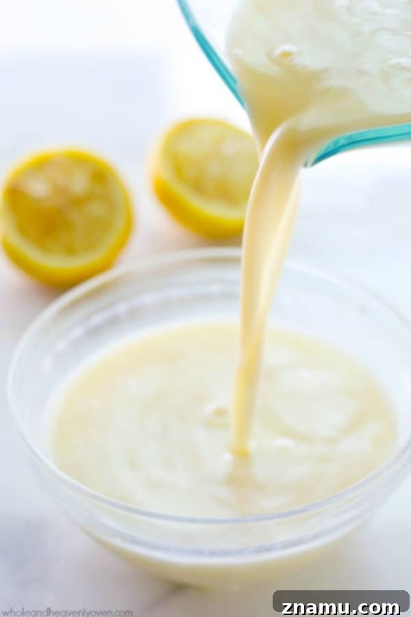 Buttermilk Magic: Just Two Ingredients 2 Freshly made homemade buttermilk in a clear glass measuring cup, ready for baking.