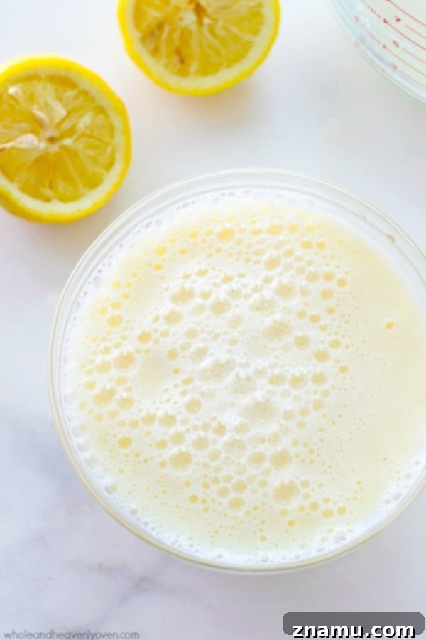 Buttermilk Magic: Just Two Ingredients 4 Pouring lemon juice into a glass of milk, initiating the curdling process to create homemade buttermilk.