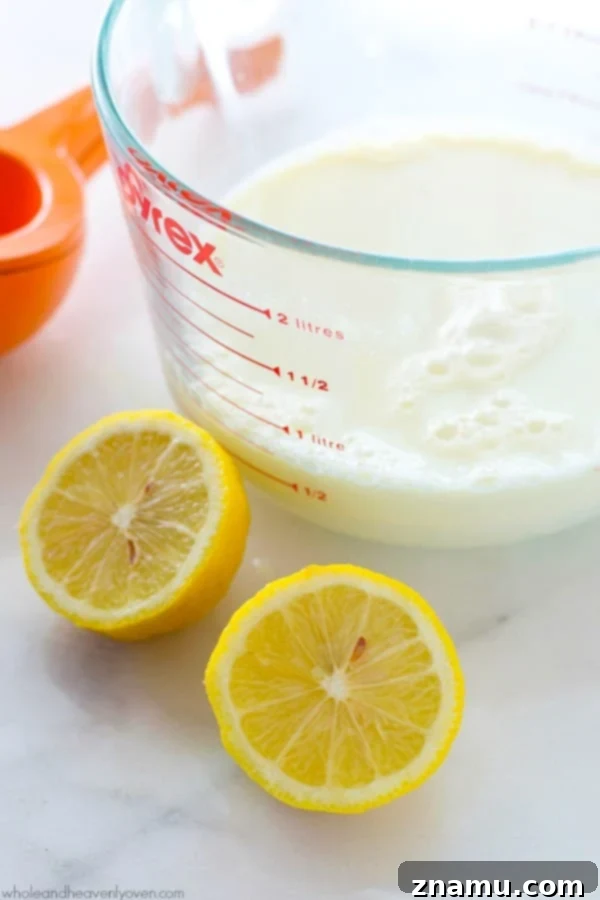 Buttermilk Magic: Just Two Ingredients 5 A whisk stirring milk and lemon juice in a bowl, demonstrating the simple preparation for DIY buttermilk.