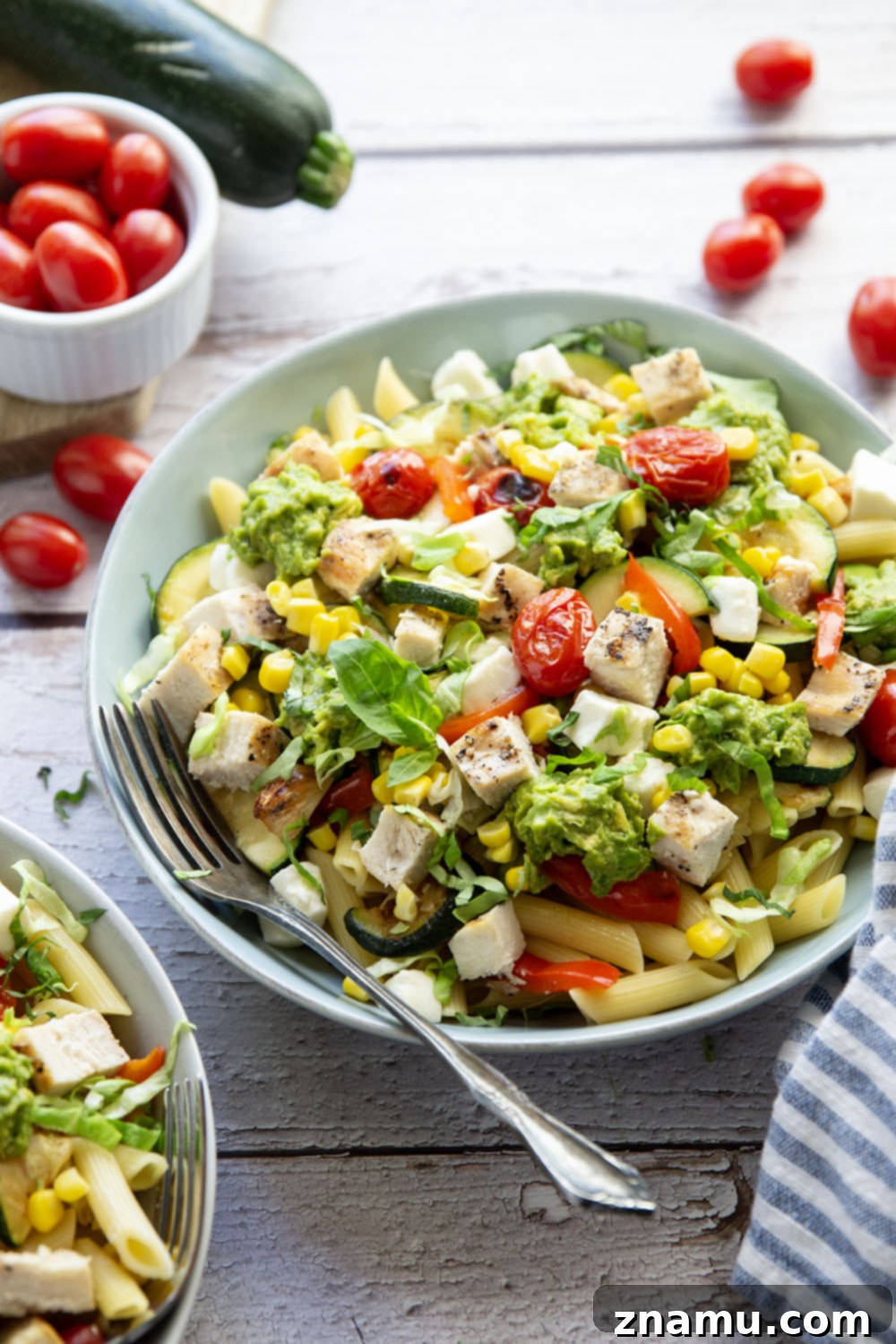 Ingredients for California grilled chicken vegetable pasta laid out on a table