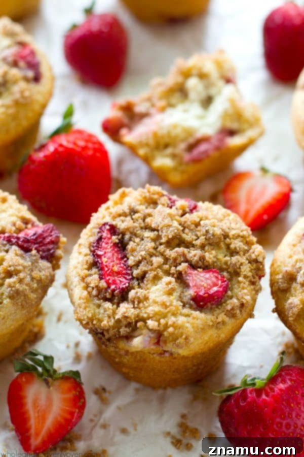 Decadent Strawberry Cheesecake Muffins 2 Delicious Strawberry Cheesecake Crumb Muffins, a perfect summer treat.