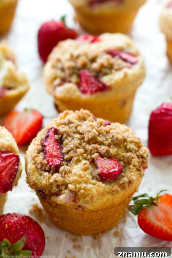 Decadent Strawberry Cheesecake Muffins 6 Close-up of Strawberry Cheesecake Crumb Muffins stacked.